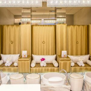 Elegant and contemporary spa interior featuring luxurious pedicure stations for relaxation.